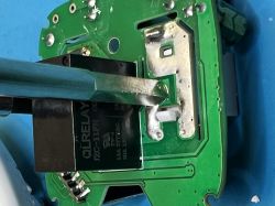 Close-up of PCB with QRELAY component and uneven solder joints