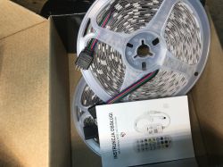 RGB LED Strip Set with Manual and Remote Contents of the RGB LED strip box, including user manual and remote control.
