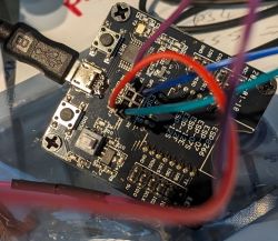 Printed circuit board with wires and electronic components.