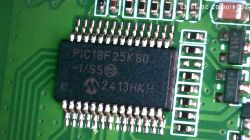 PIC18F25K80 Integrated Circuit on PCB Close-up of PIC18F25K80 integrated circuit on a green printed circuit board.