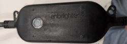 Enbrighten Lighting Module Enclosure with Button Black enclosure of Enbrighten lighting module with a button and logo.