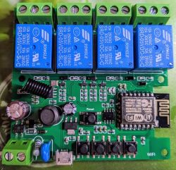 Circuit board with ESP8266 module, four blue relays, and other electronic components.