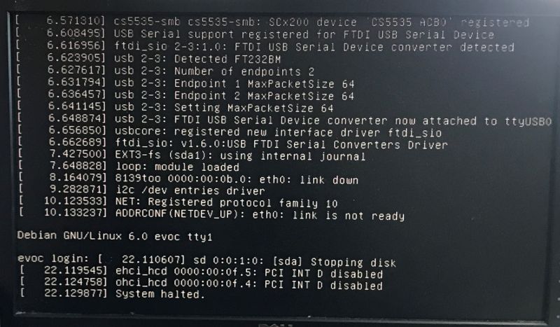 Screen showing Debian GNU/Linux boot logs ending with “System halted”