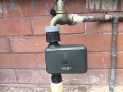 Moes Automatic Water Valve on Faucet Moes automatic water valve attached to a faucet.