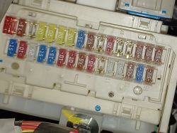 Fuse box in a Toyota Auris with empty slots.