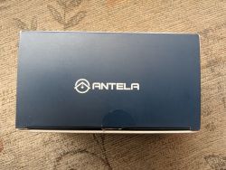 Box with ANTELA Logo Box with ANTELA logo on a carpet.