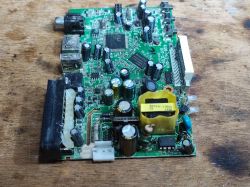 Circuit Board with Electronic Components Circuit board with various electronic components on a wooden background.