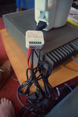 PJ-1103A measuring device with connected power wires.