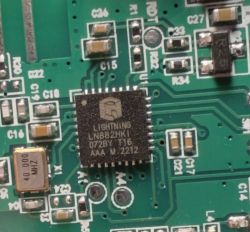 Close-up of PCB with Integrated Circuit Close-up of a PCB with a visible integrated circuit and other electronic components.