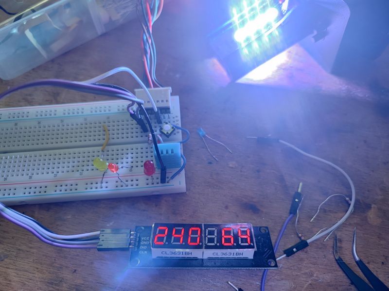 Electronic Prototype Circuit with Display and LEDs Prototype electronic circuit on a breadboard with LEDs and a display.