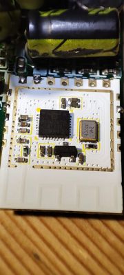 Electronic Module on PCB Close-up of an electronic module on a circuit board with a visible integrated circuit and components.