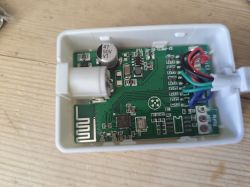 Close-up of a PCB inside a Magic Home BL602 housing with wires and electronic components.