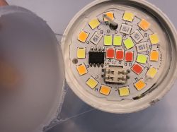 Open LED light showing diodes and an electronic component.