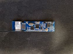 Control Module on PCB Control module with components on a blue PCB, visible identifier and connecting traces.