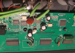 Inside the CB3S Water Monitor with Exposed Electronic Components CB3S water monitor circuit board with visible electronic components and connected cables.