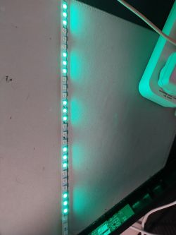 Addressable LED strip displaying green-lit diodes.