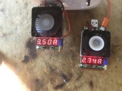 Electronic Loads with LED Displays Two electronic loads with fans and LED displays showing current values.