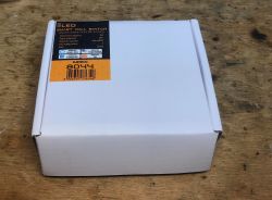 Smart LED 8044 Wall Switch Packaging A white box with a label for the Smart LED wall switch model 8044 sits on a wooden surface.