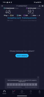 Zrzut ekranu z aplikacji Speedtest na smartfonie, pokazujący prędkość pobierania 445 Mbps i wysyłania 59,2 Mbps, z pingiem 22 ms i jitterem 5 ms.