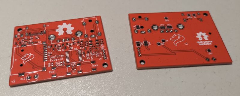 Two red PCBs with LooTunes FxDev.pl and a fox logo, populated with SMD pads