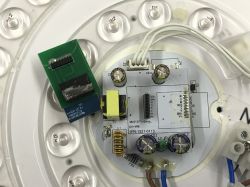 Circuit board with various electronic components and an integrated module.