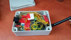 Electrical Box with Radio Modules and Wires Open electrical box with electronic modules and wires.