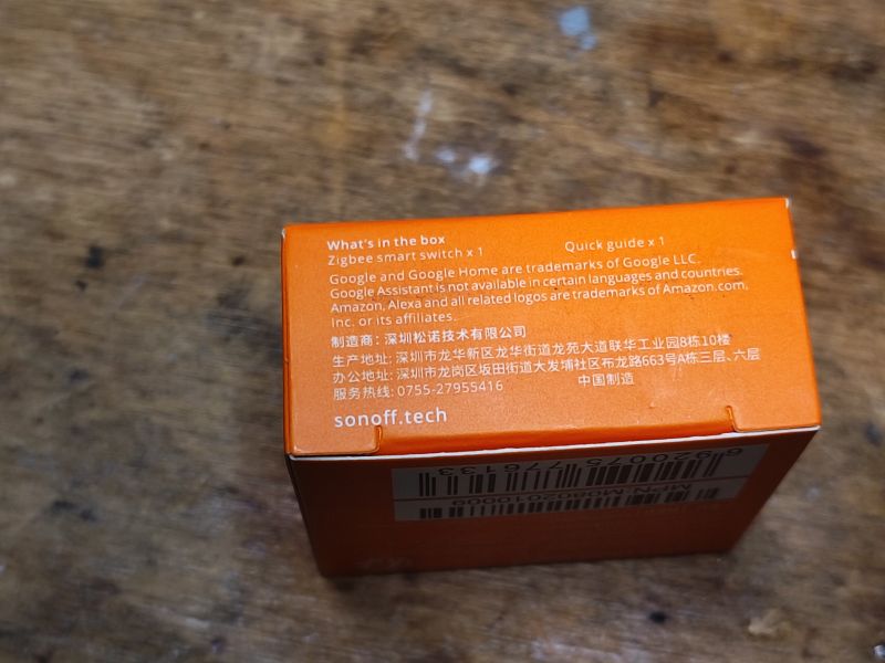 Sonoff ZBMini Box with Contents Information Orange Sonoff ZBMini box with contents and copyright information.