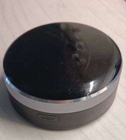 Tuya IR+RF Remote CS-SSRC-IRC Black, oval remote control with aluminum trim and a side button.
