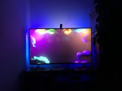 TV with Govee LED backlight displaying colorful animation on the screen