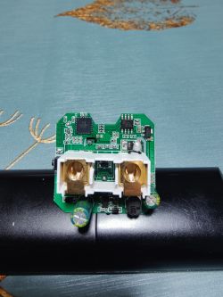 Image of an open electronic module with a PCB and electronic components.