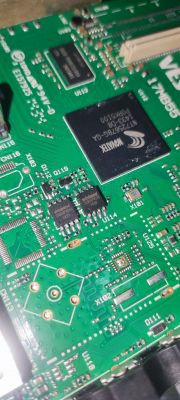Close-up of a television motherboard with visible integrated circuits.