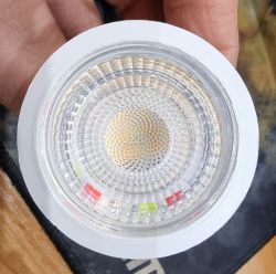 Close-up of a GU10 LED Bulb Close-up of a GU10 LED bulb with a visible transparent plastic cover.