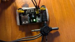 Power module with two USB ports, a button, and an active green LED light