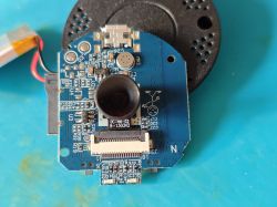 Camera module with lens and electronics on a blue PCB