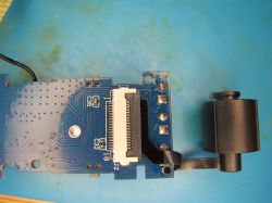 PCB with connected optical sensor and ribbon cable Close-up of a PCB with a ribbon cable connected to an optical sensor.