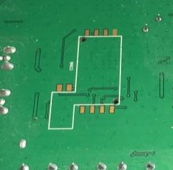 A footprint on a square scanner, likely a smartcard reader.