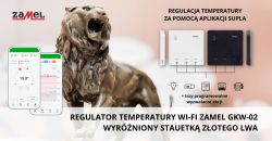 Statuetka lwa obok aplikacji Supla i regulatorów temperatury Zamel GKW-02