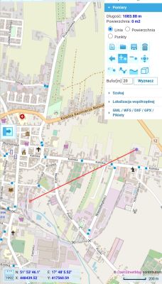 Mapa z geoportalu z wyznaczoną linią prostą o długości 1083,88 m między dwoma punktami