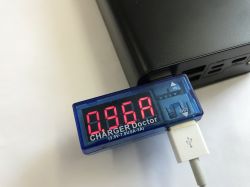 USB “CHARGER Doctor” meter with red display showing 0.96 A