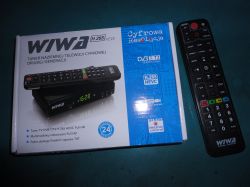 WIWA H.265 second-generation decoder with an LED display and remote control next to the box with graphics depicting the decoder and remote.