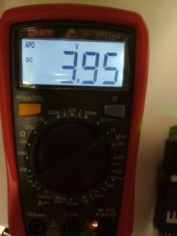 UNI-T UT33D+ multimeter display showing a reading of 3.95 V DC.