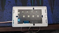 Interior of Wall Switch with LEDs Interior view of a wall switch housing with five buttons and LEDs on a circuit board.