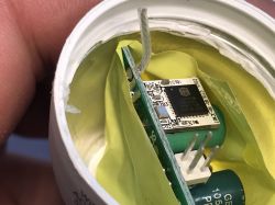 Electronic circuit inside a device with yellow insulation.