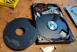 Interior of an Old Flooded Hard Drive Interior of an old hard drive with visible moisture and a removed platter.