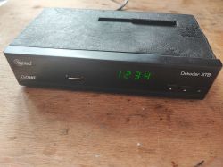 Dobo brand STB decoder displaying the time 12:34.