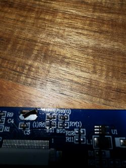 Close-up of a circuit board with marked solder points R5 and R8.