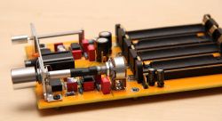 Electronic headphone amplifier board with components.