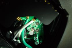 Interior of Feit Electric Outdoor Smart Plug Interior of a disassembled device showing electronic components and wiring.
