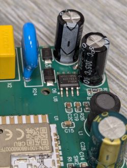 Electronic Circuit Board with CBU Module and Capacitors Close-up of an electronic circuit board with various components, including capacitors and a module labeled CBU.