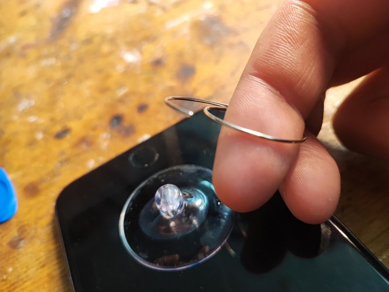 Damaged Ring During Smartphone Screen Removal Suction cup on smartphone screen with damaged ring